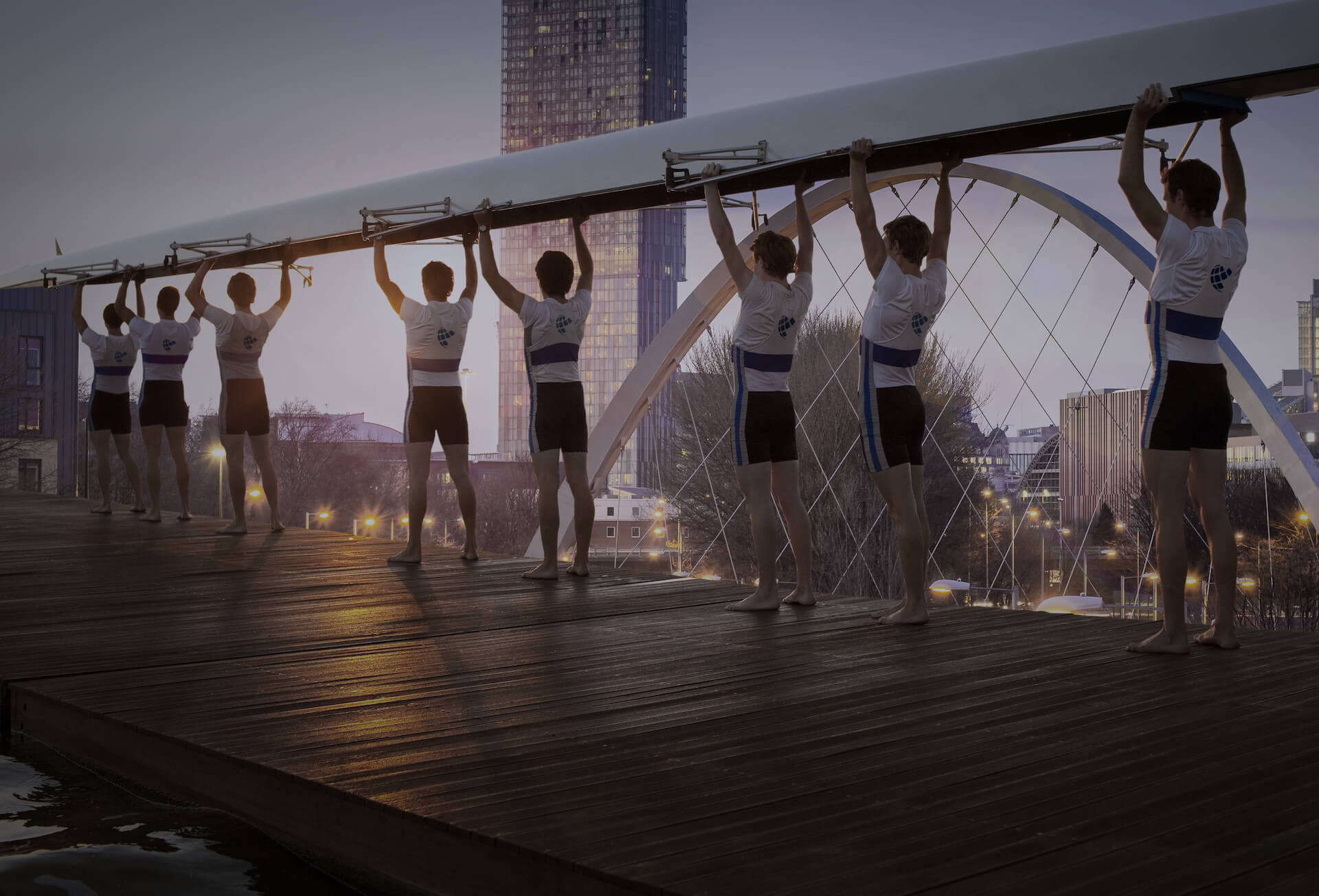 Rowers lifting boat above their heads